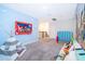 Playful ' zone featuring a vibrant Toy Story mural and cozy seating at 830 Sticks, Davenport, FL 33896