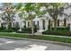 Charming townhome featuring classic architecture, black shutters, and meticulous landscaping at 906 Blue Sage St, Kissimmee, FL 34747