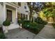 Charming front exterior view with landscaped front yard, columned porch, and welcoming front door at 906 Blue Sage St, Kissimmee, FL 34747