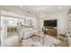 Elegant living room boasting a crystal chandelier, neutral tones, and a luxurious faux fur rug at 906 Blue Sage St, Kissimmee, FL 34747