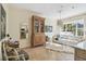 Bright and airy living room with elegant decor, a wooden cabinet, and ample natural light at 906 Blue Sage St, Kissimmee, FL 34747