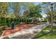 Beautiful neighborhood sitting area with brick pavers and lush green landscaping at 906 Blue Sage St, Kissimmee, FL 34747