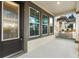 Close up of a front porch and entrance with glass door, providing bright light and curb appeal at 9149 Grand Island Way, Winter Garden, FL 34787