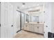 Main bathroom featuring double vanity, enclosed glass shower, and bright lighting at 9149 Grand Island Way, Winter Garden, FL 34787