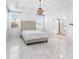 Bright main bedroom with a decorative chandelier and ensuite bathroom at 9149 Grand Island Way, Winter Garden, FL 34787