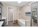 Stylish bathroom with a soaking tub, tiled shower, and modern finishes at 936 Summer Lakes Dr, Orlando, FL 32835