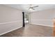 Bedroom featuring vinyl plank flooring and sliding glass doors to the exterior at 936 Summer Lakes Dr, Orlando, FL 32835