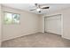 Bright bedroom featuring a ceiling fan, neutral carpet, and a window with natural light at 936 Summer Lakes Dr, Orlando, FL 32835