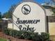 A welcoming entrance sign to Summer Lakes featuring manicured landscaping and the neighborhood's unique logo at 936 Summer Lakes Dr, Orlando, FL 32835