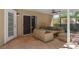 Relaxing covered patio features comfortable outdoor seating and tile flooring at 936 Summer Lakes Dr, Orlando, FL 32835