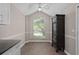 Vaulted dining room with a large window and luxury vinyl plank flooring at 936 Summer Lakes Dr, Orlando, FL 32835