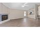 Open living room featuring luxury vinyl plank flooring and fireplace with designer tile at 936 Summer Lakes Dr, Orlando, FL 32835