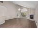 Bright living room with high ceilings, luxury vinyl plank flooring, and a fireplace at 936 Summer Lakes Dr, Orlando, FL 32835