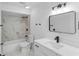 Bathroom featuring a bathtub, toilet, vanity, mirror, and modern fixtures at 1022 Glenharbor Cir, Winter Garden, FL 34787