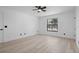 Bright bedroom featuring a ceiling fan, minimalist decor, and a window providing ample natural light at 1022 Glenharbor Cir, Winter Garden, FL 34787