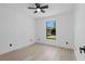 Bedroom featuring light wood floors and a window at 1022 Glenharbor Cir, Winter Garden, FL 34787