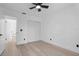 Bedroom featuring light wood flooring, ceiling fan and closet at 1022 Glenharbor Cir, Winter Garden, FL 34787