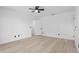 Bright bedroom featuring light wood flooring, ceiling fan and closet at 1022 Glenharbor Cir, Winter Garden, FL 34787