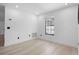 Light filled bedroom with recessed lights, light wood flooring, and large window at 1022 Glenharbor Cir, Winter Garden, FL 34787