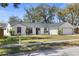 Beautiful home with white siding, black trim, updated roof and landscaping at 1022 Glenharbor Cir, Winter Garden, FL 34787