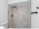 Modern shower with large marble tiles and black hardware at 1022 Glenharbor Cir, Winter Garden, FL 34787