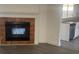 Cozy living room featuring a tiled fireplace and vinyl floors next to the kitchen at 1059 Manigan Ave, Oviedo, FL 32765