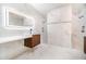 Bright bathroom featuring marble-style tiling, modern vanity, and glass-enclosed shower at 1215 Crawford Ave, St Cloud, FL 34769