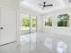 Bright bedroom features a large sliding glass door and natural light and marble floors at 1215 Crawford Ave, St Cloud, FL 34769