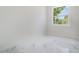 Bright bedroom featuring marble-style flooring and natural light at 1215 Crawford Ave, St Cloud, FL 34769