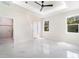 Bright bedroom featuring marble-style flooring, ensuite bathroom, and natural light at 1215 Crawford Ave, St Cloud, FL 34769