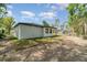 Side exterior view of the home featuring a white exterior at 1215 Crawford Ave, St Cloud, FL 34769