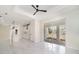 Open-concept living room with marble-style flooring, leading into the modern kitchen at 1215 Crawford Ave, St Cloud, FL 34769