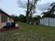 Large backyard, with a shed, a tree, and a blue container at 1246 Rhodes Ct, Orlando, FL 32808