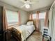 Bright bedroom with wood floors, ceiling fan, large windows and pink curtains at 1246 Rhodes Ct, Orlando, FL 32808