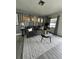 Comfortable living room featuring neutral tones, a plush rug, and stylish furniture with wood-look floors at 1246 Rhodes Ct, Orlando, FL 32808