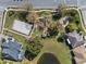 Aerial view of a community with a volleyball court, playground, walking paths and a pond at 1601 Carillon Park Dr, Oviedo, FL 32765