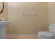 Bathroom featuring a toilet and pedestal sink at 1601 Carillon Park Dr, Oviedo, FL 32765