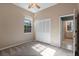 Light-filled bedroom featuring a closet with bi-fold doors and a view to the en suite bathroom at 1601 Carillon Park Dr, Oviedo, FL 32765