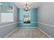 This dining room boasts gray walls and a large window allowing lots of natural light at 1601 Carillon Park Dr, Oviedo, FL 32765