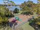 Community playground with slides, swings, and lake views at 1601 Carillon Park Dr, Oviedo, FL 32765