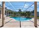 Beautiful screened-in pool area with a tranquil waterfall feature for relaxing outdoor living at 1601 Carillon Park Dr, Oviedo, FL 32765