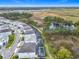 Aerial view of new home community with wetland view and enclosed pools at 1739 Oak Blossom Dr, Davenport, FL 33837