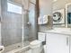 Clean bathroom with glass-enclosed shower, contemporary vanity, and minimalist decor at 1739 Oak Blossom Dr, Davenport, FL 33837