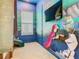 Whimsical ' bedroom featuring a Frozen-themed mural and a fun slide for imaginative play at 1739 Oak Blossom Dr, Davenport, FL 33837