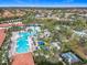 Aerial view of the community pool and splash pad area with picnic tables at 1739 Oak Blossom Dr, Davenport, FL 33837