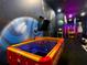 This game room features Pac-Personal air hockey table and custom space-themed wall decor at 1739 Oak Blossom Dr, Davenport, FL 33837