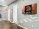 Hallway featuring a dart board and geometric wall accents, creating a fun and stylish transition space at 1739 Oak Blossom Dr, Davenport, FL 33837