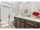 Well-maintained bathroom featuring a glass-enclosed shower, contemporary vanity, and clean, functional design at 1832 Sandy Park Trl, Kissimmee, FL 34747