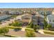 An aerial view of a residential neighborhood showcasing well-maintained landscaping and ample parking at 1832 Sandy Park Trl, Kissimmee, FL 34747