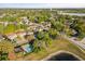 Overhead view of suburban neighborhood with tree-lined streets, community pool, and lake access at 1899 Valley Wood Way, Lake Mary, FL 32746